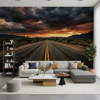 Road landscape wall mural with storm clouds and warm sunset color contrast