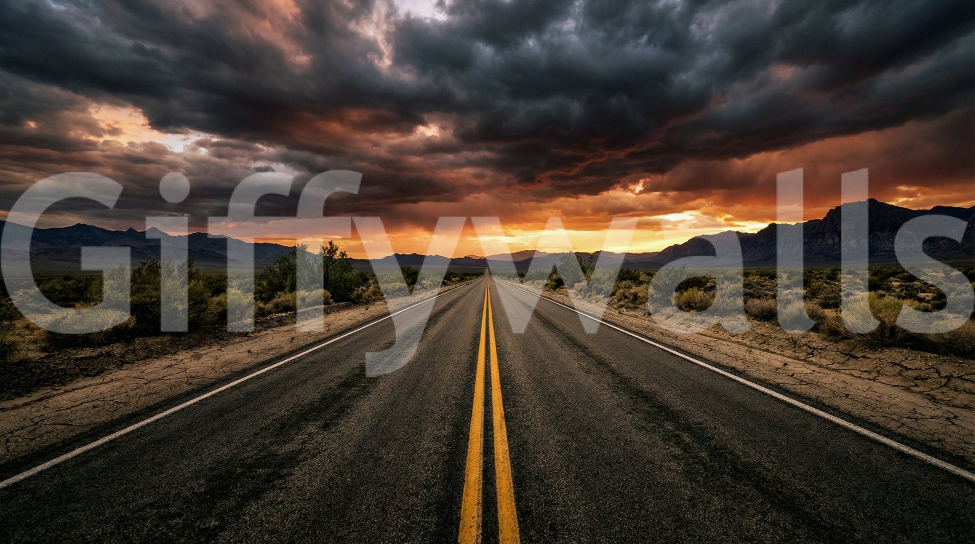 Moody highway wall mural with distant mountains and glowing evening light