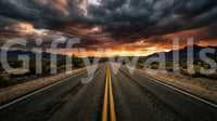 Moody highway wall mural with distant mountains and glowing evening light
