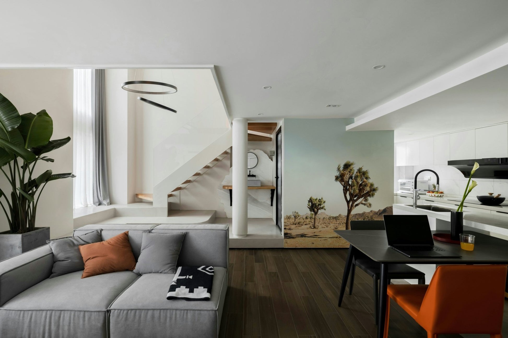 Tree standing alone in dry desert field

