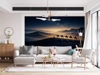 A line of camels and riders crosses the top of a dune on this desert wall mural
GD9566