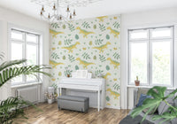 Soft green foliage and yellow on Dino Nursery Wallpaper.