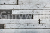 Applying the simple, removable peel and stick wood panel wallpaper.