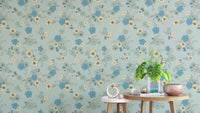 Sophisticated pastel blue wallpaper with scattered floral motifs.
