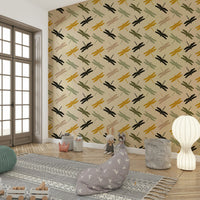 Graphic dragonfly pattern on a matte mustard wall covering.

