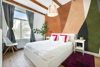 A wall mural with a series of overlapping arches.

