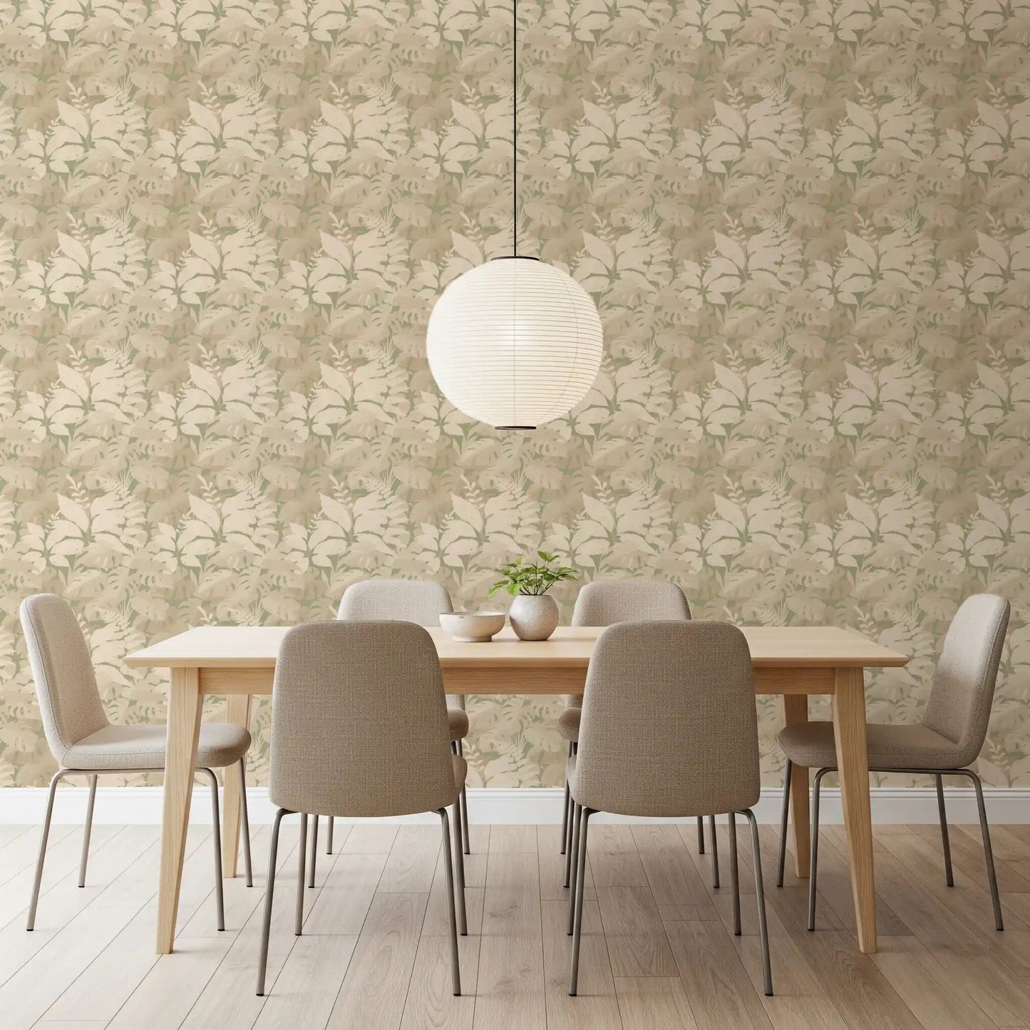 Earthy Tropics Silhouette Monstera Leaves Wallpaper in a softly lit dining room