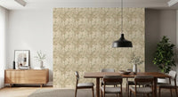 Earthy Tropics Silhouette Monstera Leaves Wallpaper behind a soft beige bed