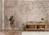 Wall mural with old-world map and greenery


