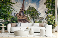 A Living area setting feels bright beside Eiffel Tower Greens wall mural backdrop