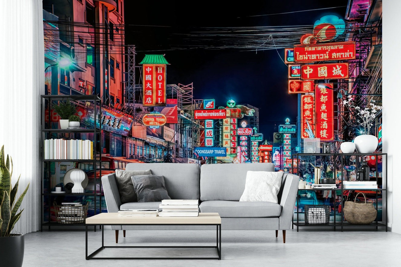 Busy Bangkok street lit up with neon signs

