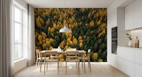 A dining area opens onto golden treetops with Emerald and Gold Forest Canopy wall mural.GD9602