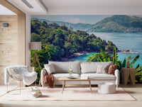 Emerald Coast Wall Mural brings tropical hillside calm into this warm sitting room