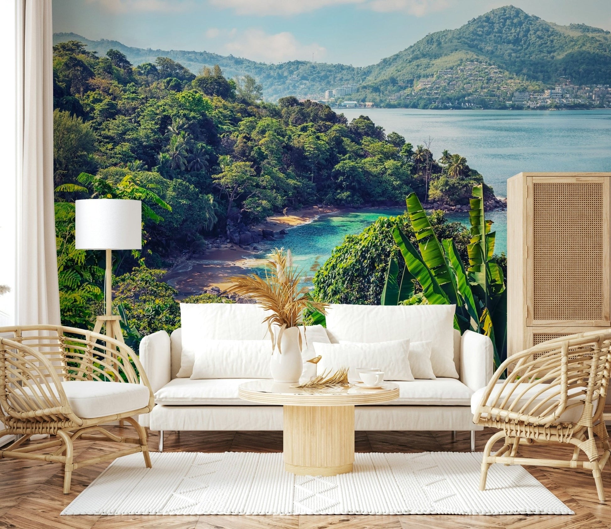 A bright seating room paired with Emerald Coast Wall Mural and lush shoreline detail