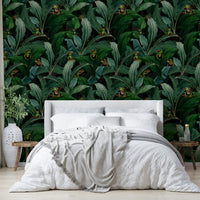 Close-up of emerald eyes peering through jungle foliage wallpaper., GD1381