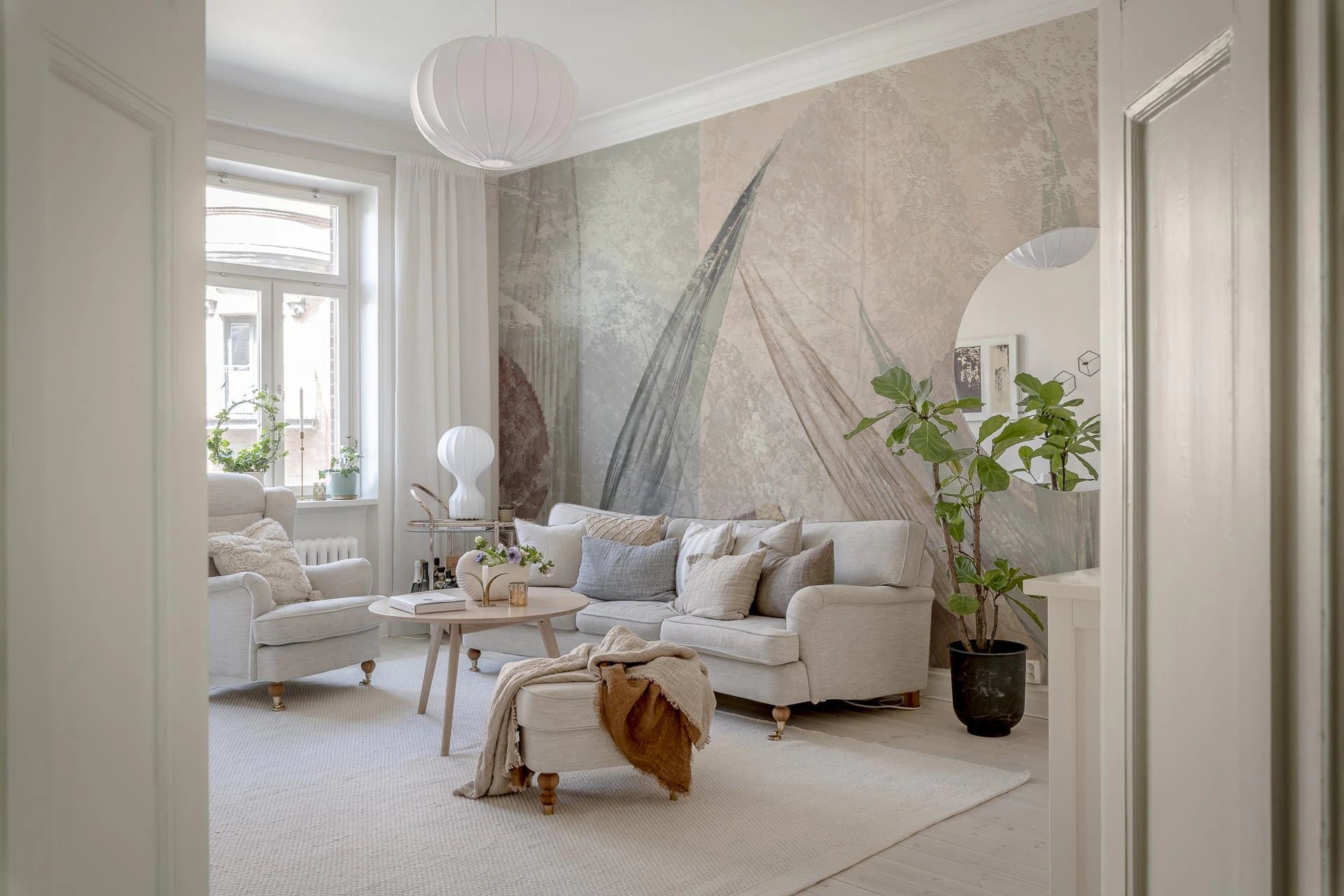 Living room with Ethereal Leaves Cream Wall Mural and a calm spa-like setup