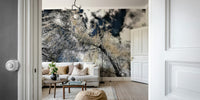 The wall mural is installed on a living room feature wall.


