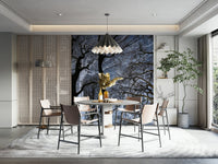 Features abstract tree silhouettes, sharply defined against a dark or moody sky., GD2686