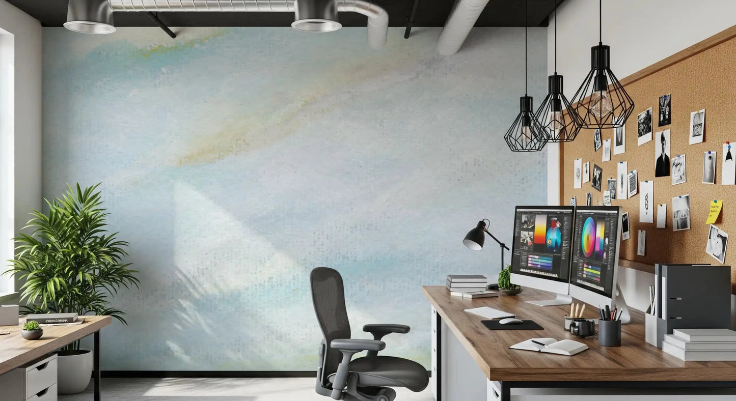 Pale blue wall mural shows gentle brushed texture with soft yellow cream traces