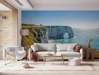 A light-filled family room gains scenic cliffside depth from Etretat's Yellow Bloom Wall Mural