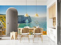 Behind the bed, Etretat's Yellow Bloom Wall Mural creates a calm oceanfront feature