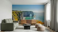 Etretat's Yellow Bloom Wall Mural brings floral coastal charm into this relaxed sitting area