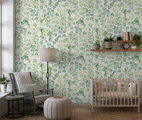 Soft green leaf wallpaper with botanical stems for a nursery wall mural.