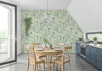 Eucalyptus Dream Garden Wallpaper behind a wooden desk in a home office wallpaper.