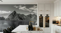 Professional meeting room mural showing a sharp mountain peak and a small red cottage.