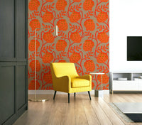 Accent wall with coral botanical wallpaper
