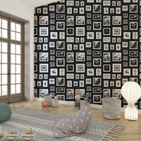 Dark anthracite wallpaper with whimsical creatures.

