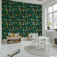 A cheerful holiday bulb pattern on a deep green wallpaper for walls.