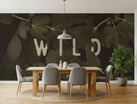 A beautiful botanical wallpaper mural featuring fig leaves and the phrase 'Stay Wild'.