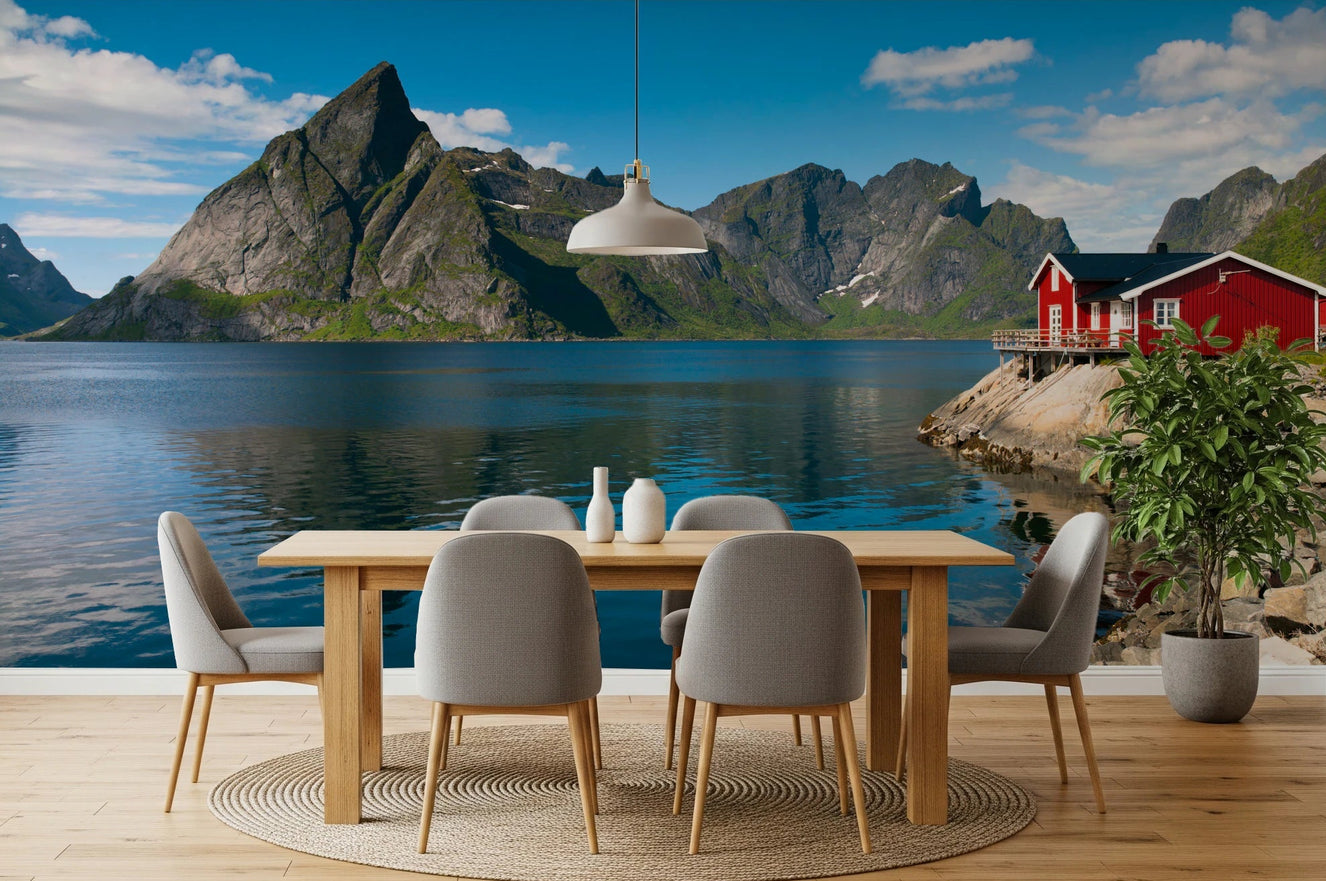Dining area with round table set before Fishing Huts Wall Mural lake view