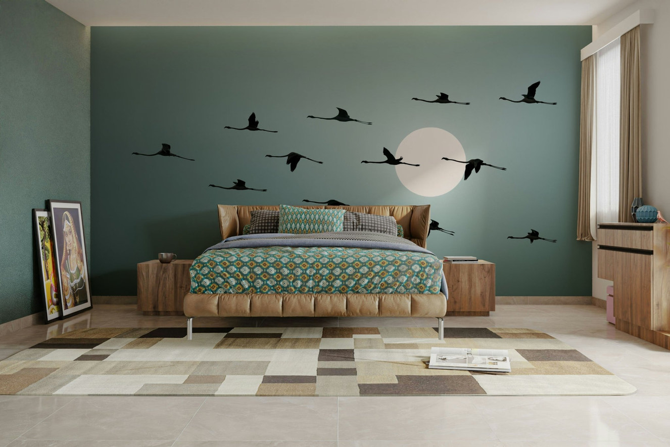 A wall mural of a serene flamingo scene at sunset.

