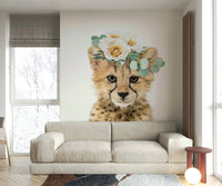 Cute cheetah cub surrounded by florals in a wall mural.

