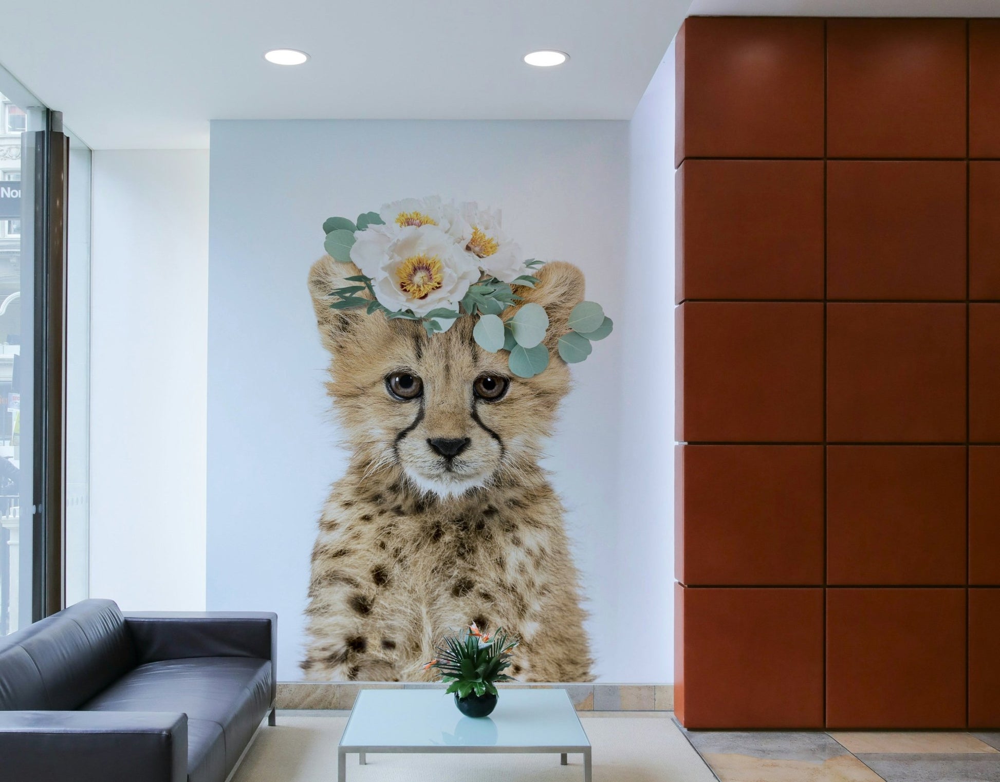 Nature-inspired floral cheetah cub wall mural for unique decor.

