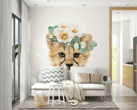 Cheetah cub with floral elements on a nature-inspired mural.


