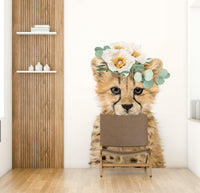 Playful floral cheetah cub wall mural for lively interiors.

