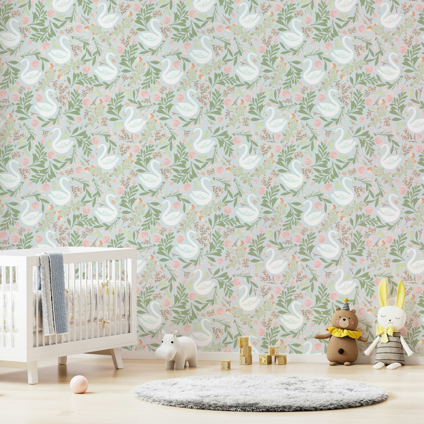 The image shows an artistic impression of a serene scene with swans on a lake and floral elements.

