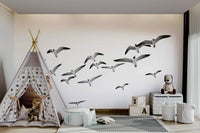 Panoramic mural with flock of birds in graceful flight

