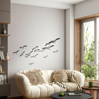 Vertical mural featuring birds soaring upward

