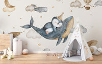 Penguin riding whale nursery wallpaper
