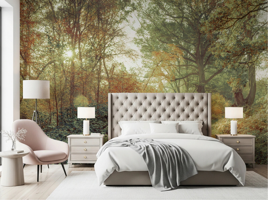 Bedroom with Forest Glow Wall Mural behind a tufted bed and pink accent chair