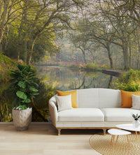 The colors are soft and muted, with various shades of green, brown, and blue.

