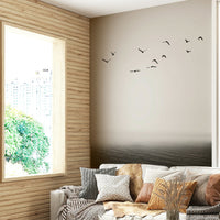 The design may include elements like soaring birds, running animals, or fluid, dynamic shapes.
