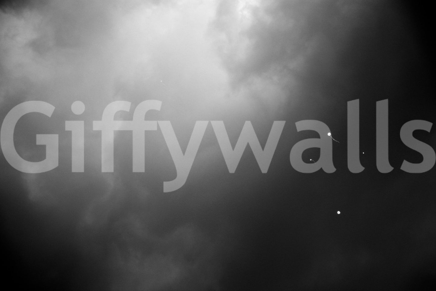 Four Balloons and Another One wall mural showing tiny balloons in a smoky grey sky GD4888

