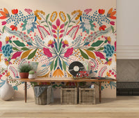 Frida's Garden wallpaper behind a contemporary sofa.