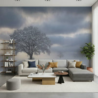 Breathtaking winter mural featuring a majestic, frosted tree in fog.