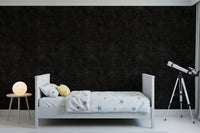 Soft speckled texture covers this Charcoal Wallpaper with star field detail